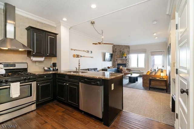a kitchen with a sink and a stove top oven
