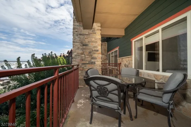 a view of a balcony with furniture