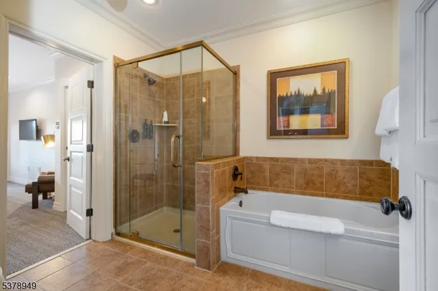 a bathroom with a tub and shower