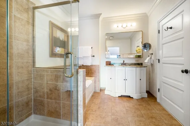 a bathroom with a granite countertop sink mirror and