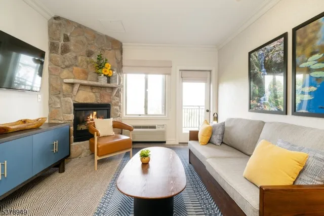 a bedroom with furniture and a fireplace