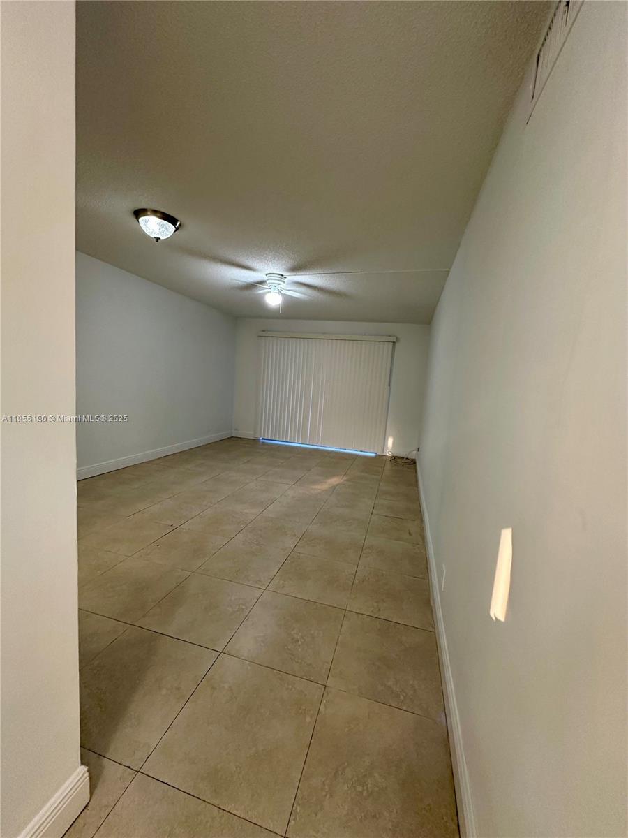 603 South State Road 7, Unit 1E Margate, FL 33068 - Photo 3 of 8 a view of hallway with a window
