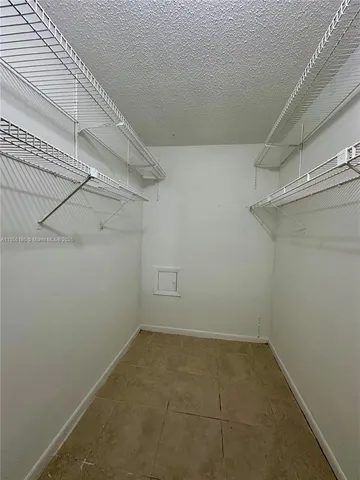a view of a room with racks on the wall