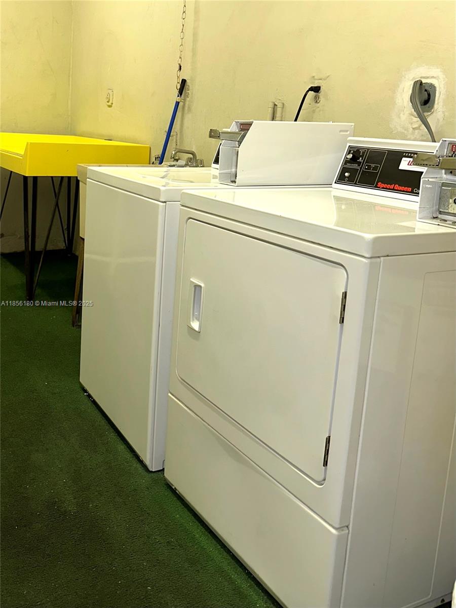 603 South State Road 7, Unit 1E Margate, FL 33068 - Photo 8 of 8 a utility room with dryer and washer
