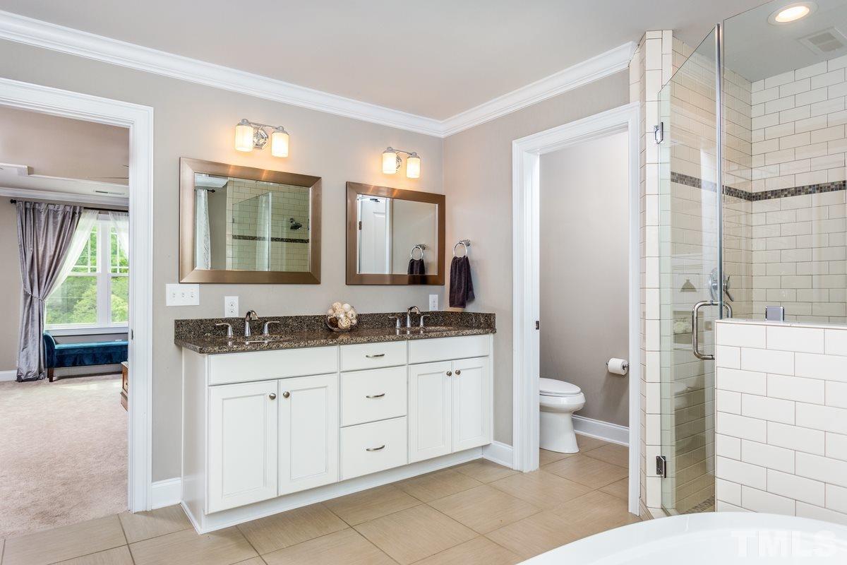 1429 Nottingham Road Raleigh, NC 27607 - Photo 12 of 25 a bathroom with a toilet sink and mirror
