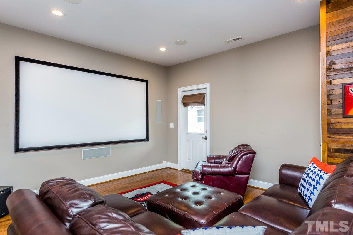 1429 Nottingham Road Raleigh, NC 27607 - Photo 20 of 25 a bedroom with a bed and a couch