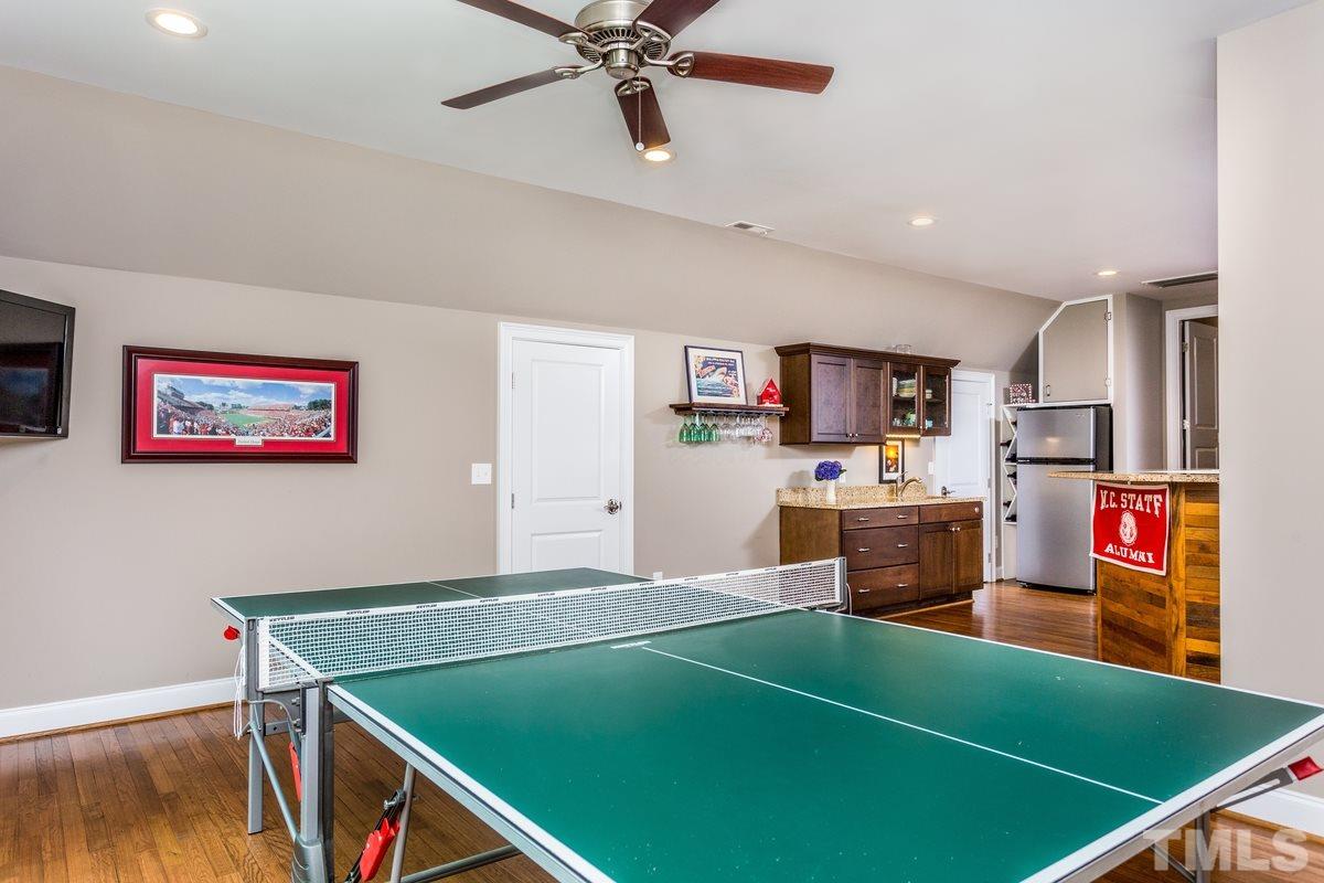 1429 Nottingham Road Raleigh, NC 27607 - Photo 23 of 25 a room with pool table and a projector screen