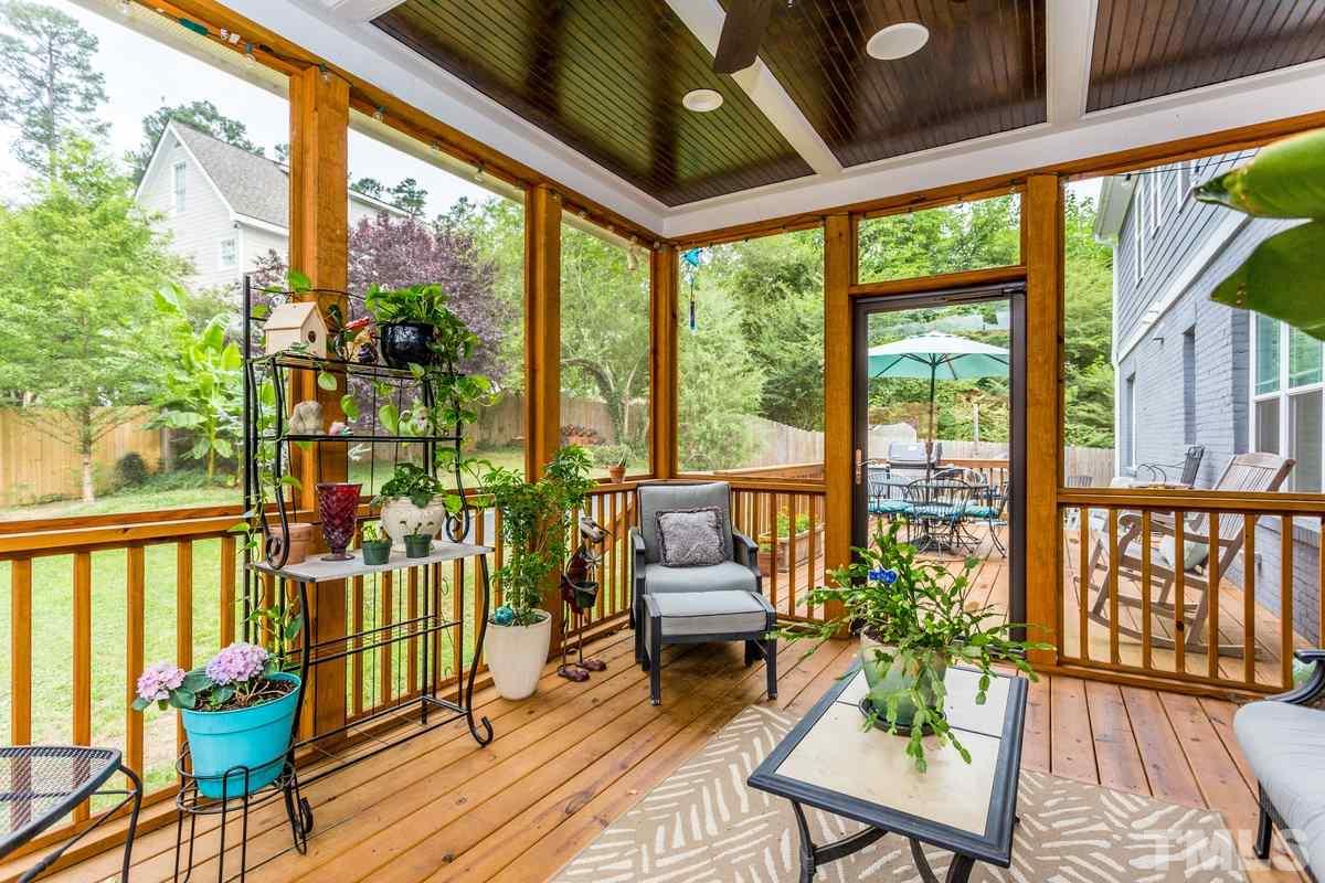 1429 Nottingham Road Raleigh, NC 27607 - Photo 24 of 25 a balcony with wooden floor and outdoor seating