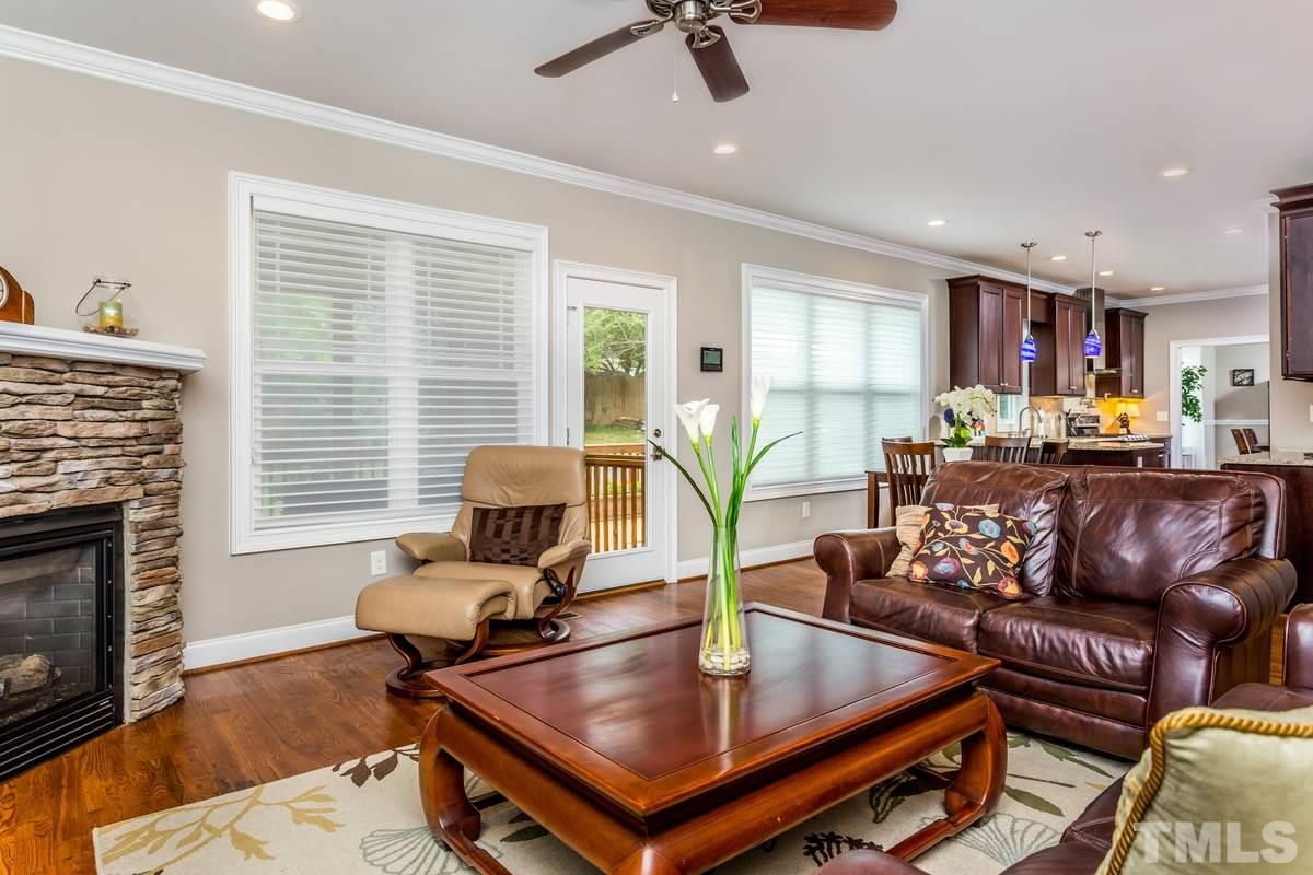1429 Nottingham Road Raleigh, NC 27607 - Photo 5 of 25 a living room with furniture and a fireplace
