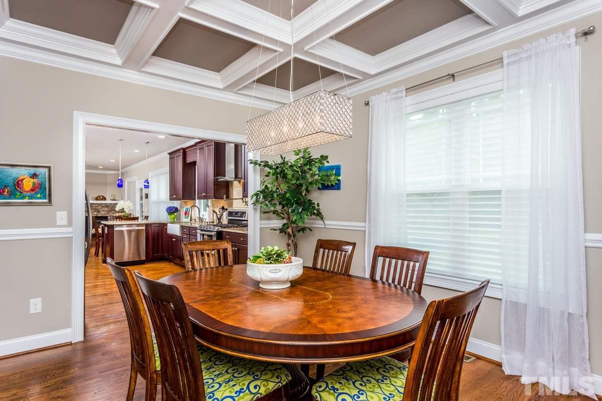 1429 Nottingham Road Raleigh, NC 27607 - Photo 9 of 25 a dining room with furniture a window and wooden floor