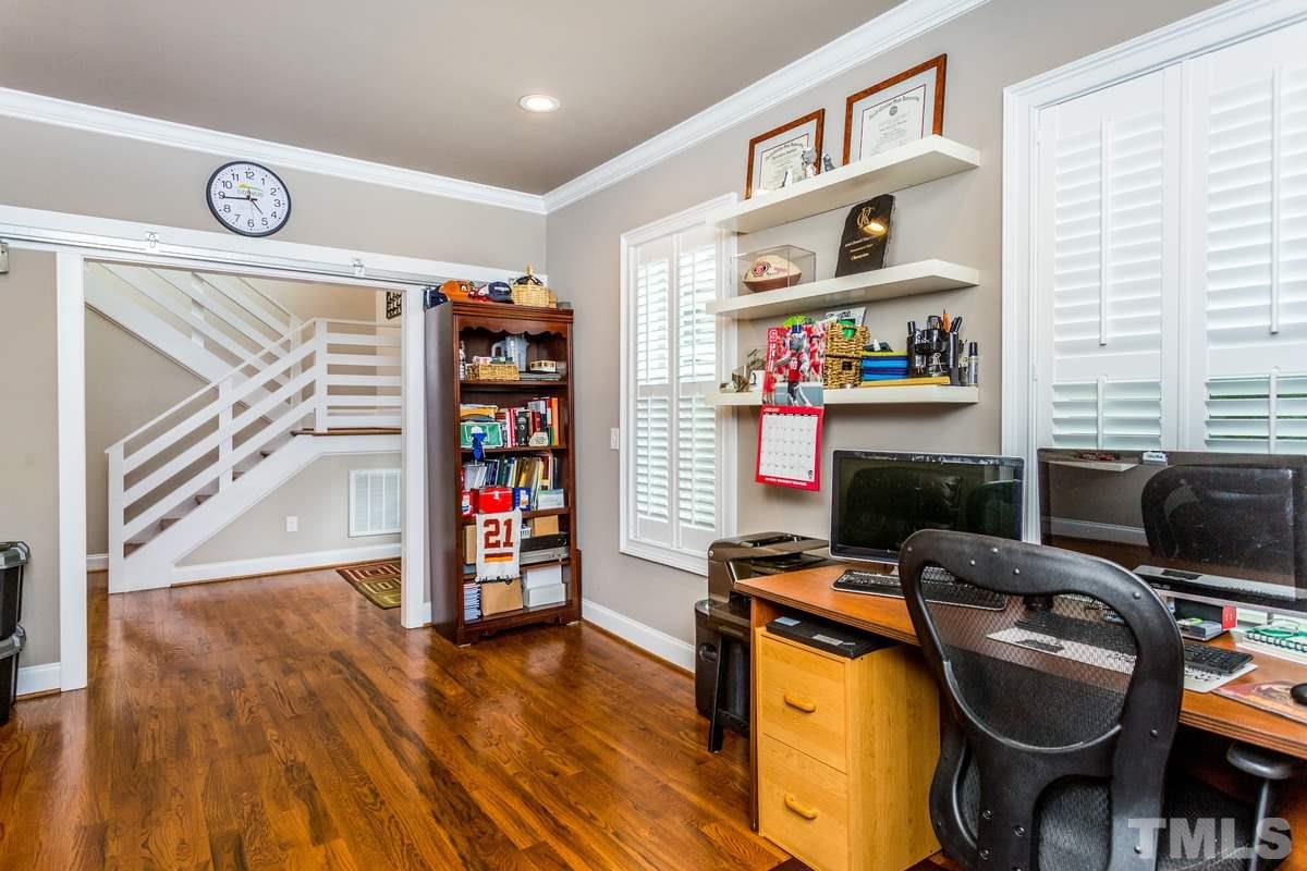 1429 Nottingham Road Raleigh, NC 27607 - Photo 10 of 25 a view of a workspace with furniture and a window