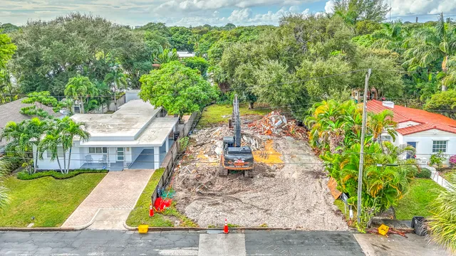 an aerial view of a house with a yard and garden
