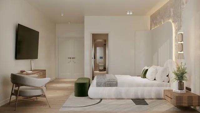 a bedroom with a bed and a chair