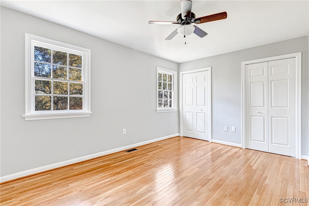 9101 Derbyshire Road, Unit E Henrico, VA 23229 - Photo 18 of 37 Unfurnished bedroom featuring light hardwood / woo