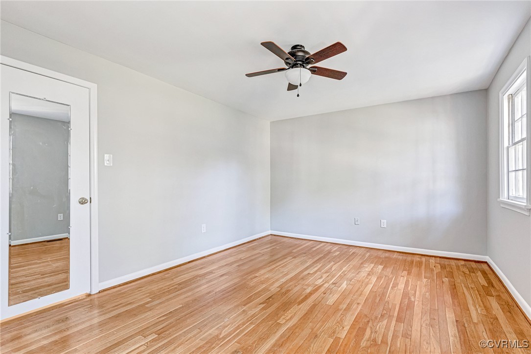 9101 Derbyshire Road, Unit E Henrico, VA 23229 - Photo 19 of 37 Empty room with light hardwood / wood-style floori