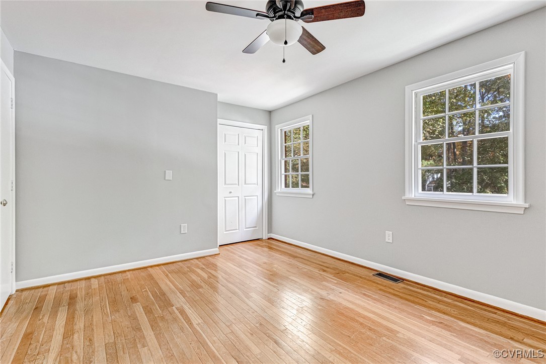 9101 Derbyshire Road, Unit E Henrico, VA 23229 - Photo 21 of 37 Unfurnished bedroom with light hardwood / wood-sty