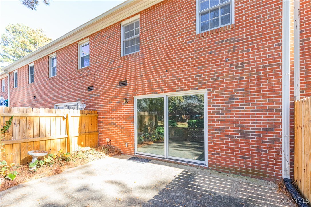 9101 Derbyshire Road, Unit E Henrico, VA 23229 - Photo 24 of 37 Rear view of house with a patio area