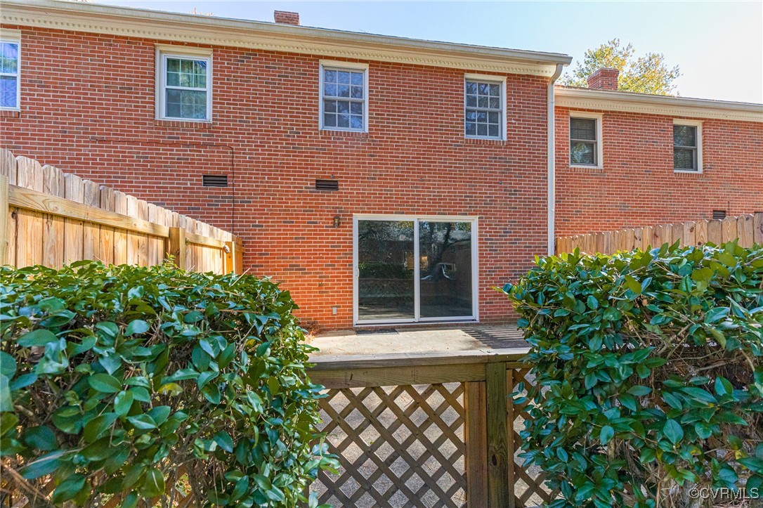 9101 Derbyshire Road, Unit E Henrico, VA 23229 - Photo 26 of 37 Rear view of property with a patio area