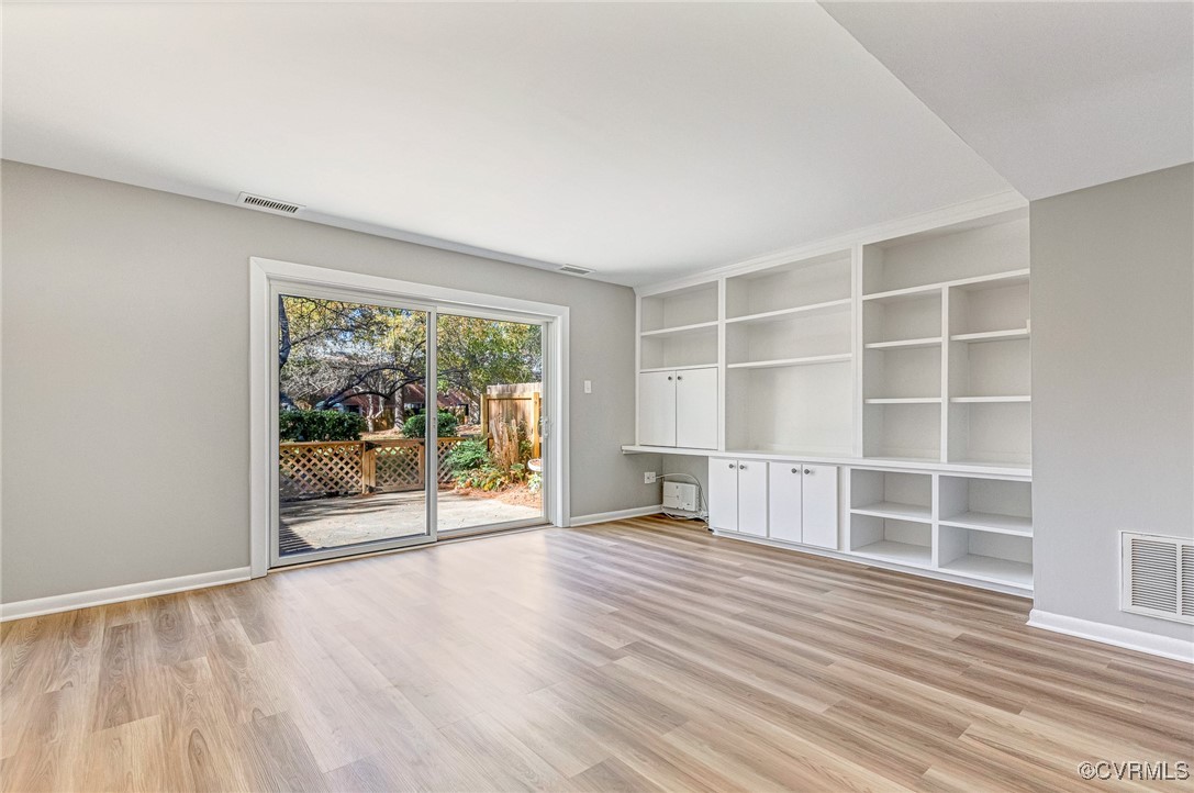 9101 Derbyshire Road, Unit E Henrico, VA 23229 - Photo 5 of 37 Empty room featuring light wood-type flooring