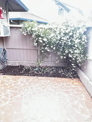 a view of a backyard of the house