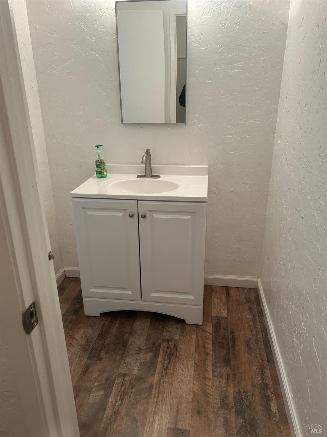 311 Algiers Court Santa Rosa, CA 95409 - Photo 13 of 20 a bathroom with a sink and a mirror
