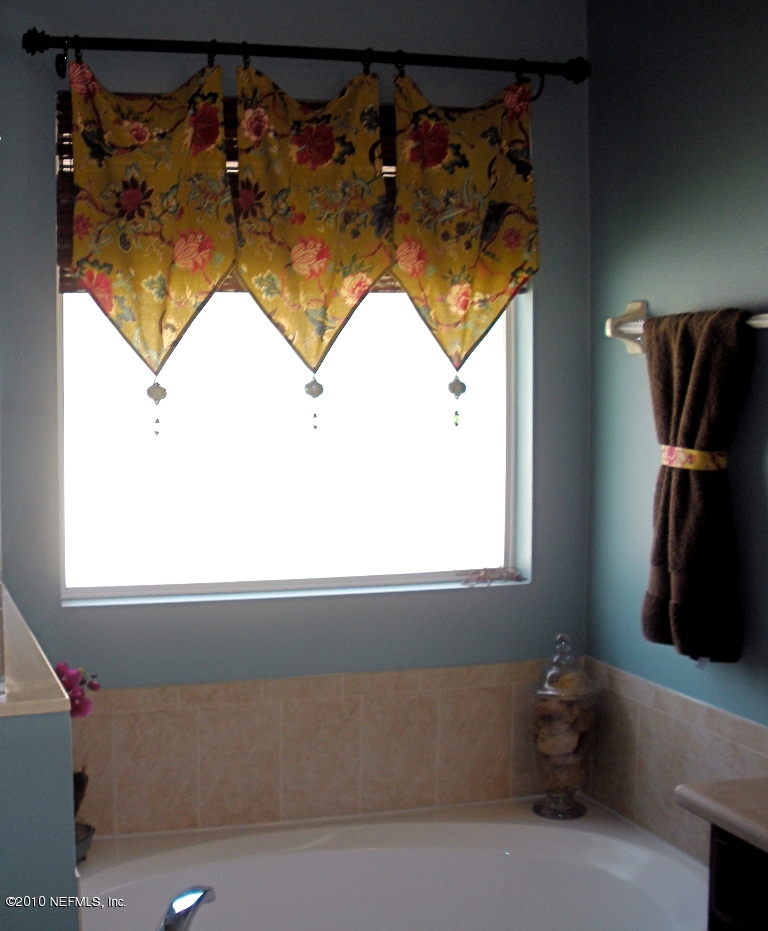 55 Amherst Place Ponte Vedra, FL 32081 - Photo 11 of 17 a bathroom with a sink and a mirror