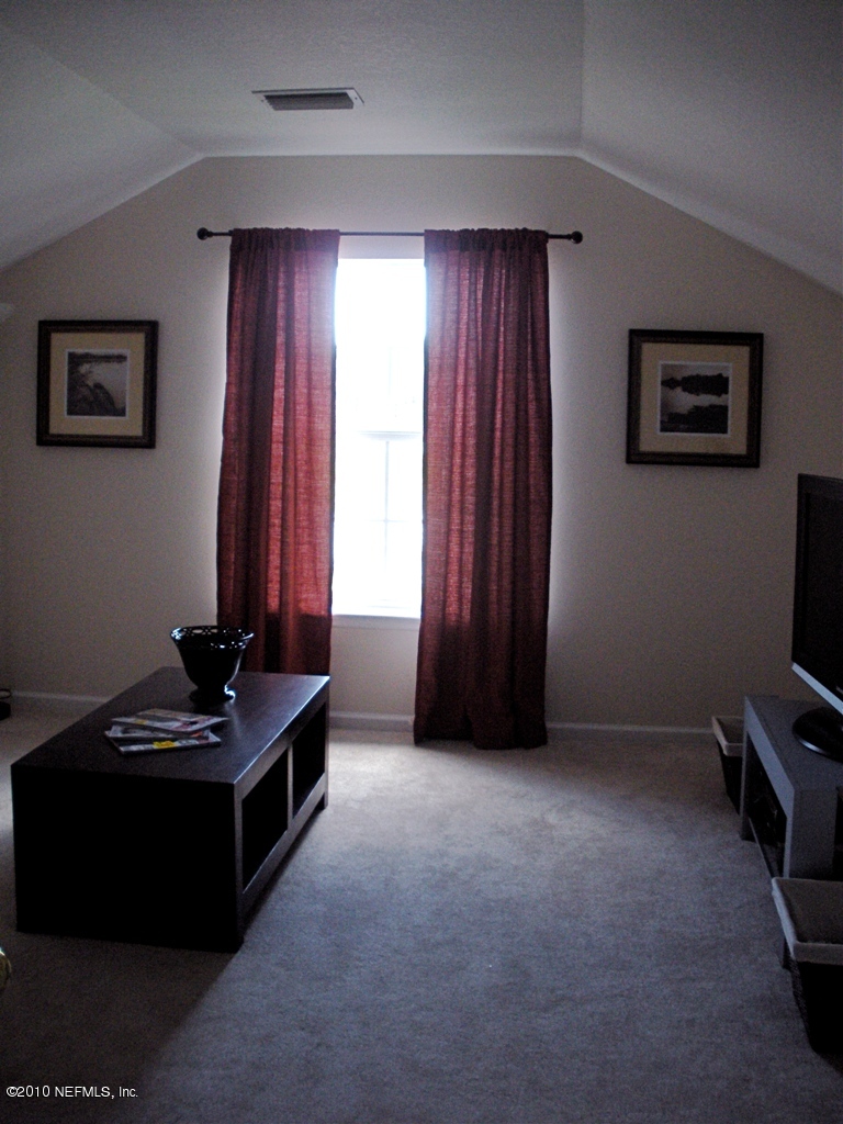 55 Amherst Place Ponte Vedra, FL 32081 - Photo 15 of 17 a room with furniture and a flat screen tv