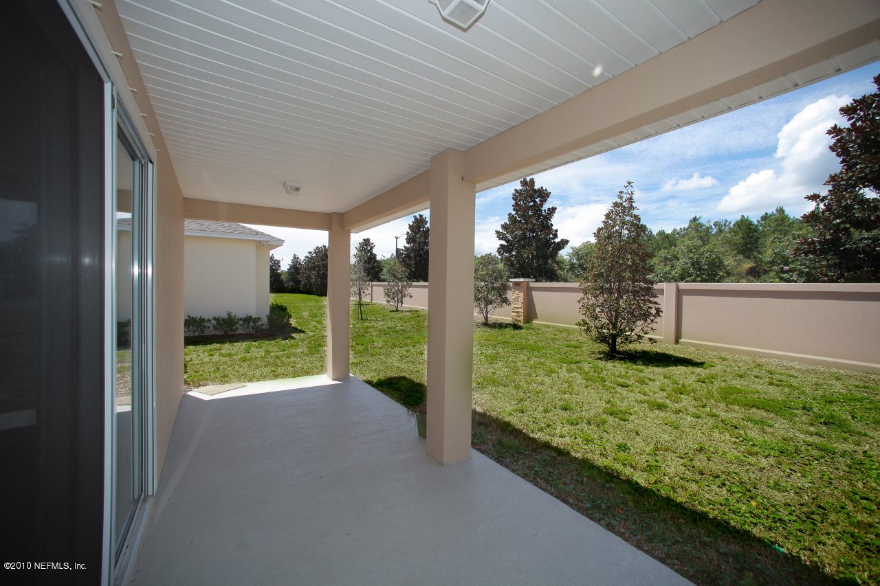 55 Amherst Place Ponte Vedra, FL 32081 - Photo 17 of 17 a view of backyard with large trees and plants