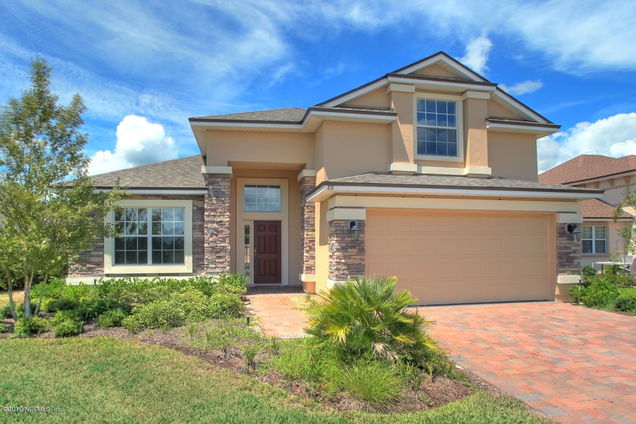 55 Amherst Place Ponte Vedra, FL 32081 - Photo 2 of 17 a front view of a house with a yard