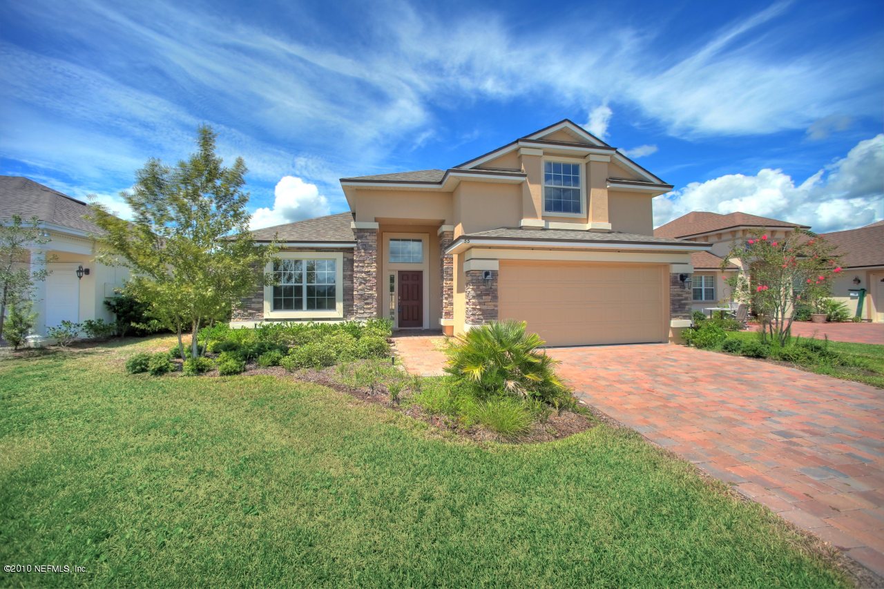 55 Amherst Place Ponte Vedra, FL 32081 - Photo 3 of 17 a front view of a house with a yard