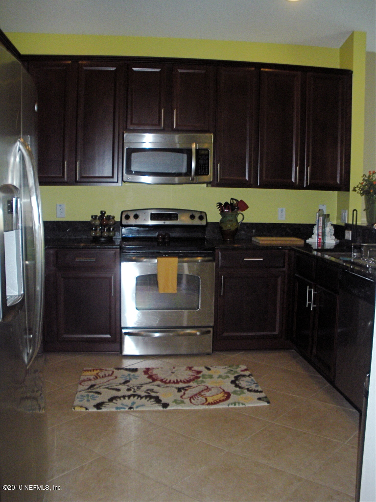 55 Amherst Place Ponte Vedra, FL 32081 - Photo 5 of 17 a kitchen with a sink and a stove