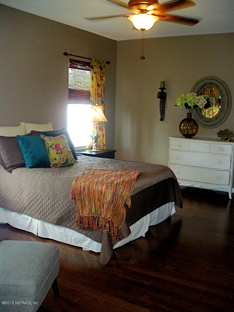 55 Amherst Place Ponte Vedra, FL 32081 - Photo 9 of 17 a bedroom with a bed and painting on the wall