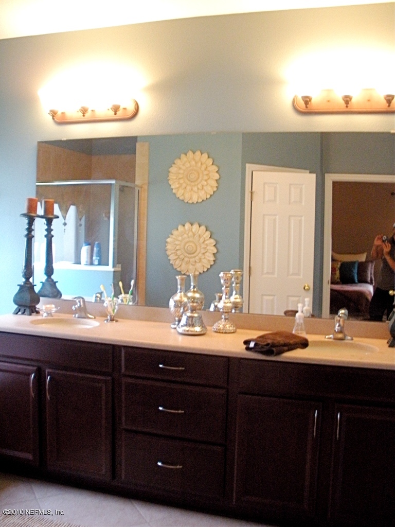 55 Amherst Place Ponte Vedra, FL 32081 - Photo 10 of 17 a bathroom with a sink and a mirror