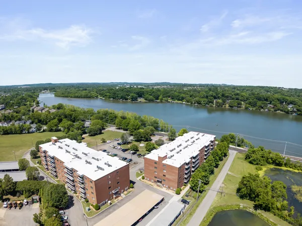 an aerial view of a house with lake view