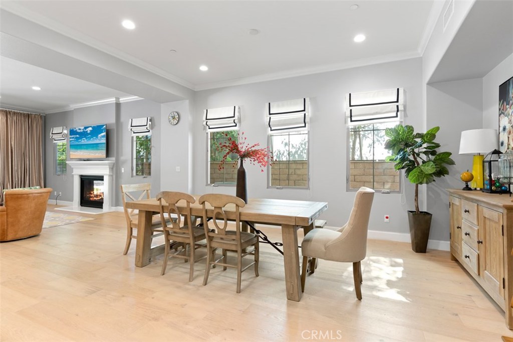 26 Lowland Irvine, CA 92602 - Photo 16 of 44 a view of a dining room with furniture window and wooden floor