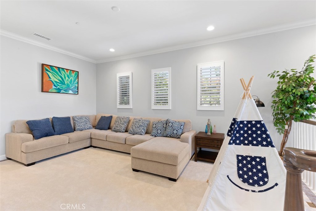 26 Lowland Irvine, CA 92602 - Photo 19 of 44 a living room with furniture a couch and a potted plant