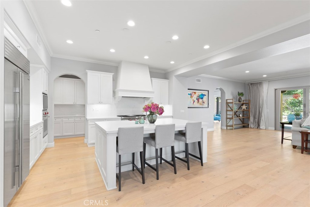 26 Lowland Irvine, CA 92602 - Photo 2 of 44 a kitchen with stainless steel appliances kitchen island granite countertop lots of white cabinets and stainless steel appliances