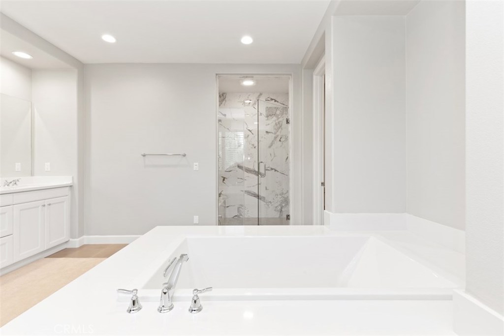 26 Lowland Irvine, CA 92602 - Photo 25 of 44 a bathroom with a bathtub and shower