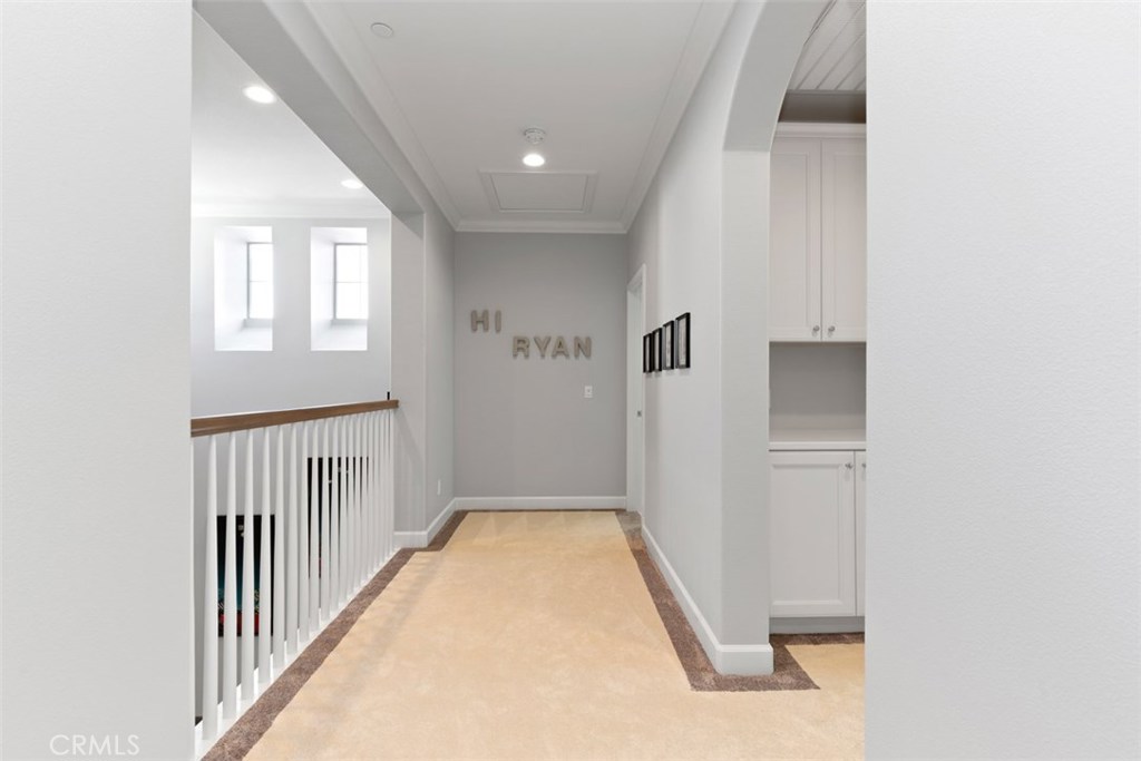 26 Lowland Irvine, CA 92602 - Photo 28 of 44 a view of a hallway with a white walls