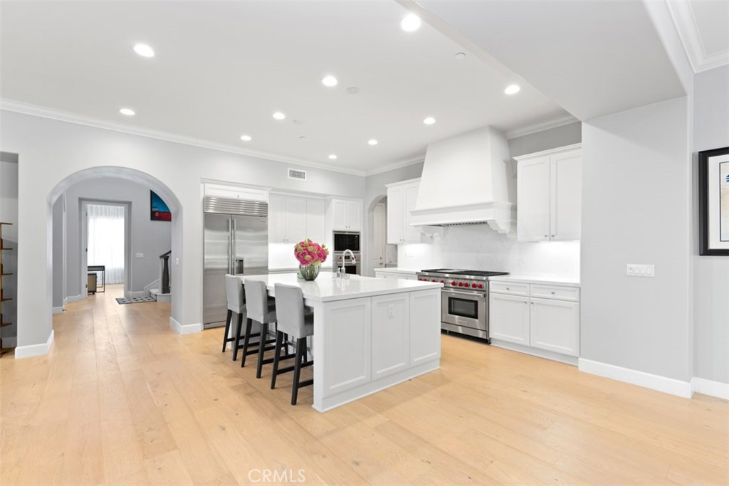 26 Lowland Irvine, CA 92602 - Photo 3 of 44 a kitchen with a sink stainless steel appliances and cabinets