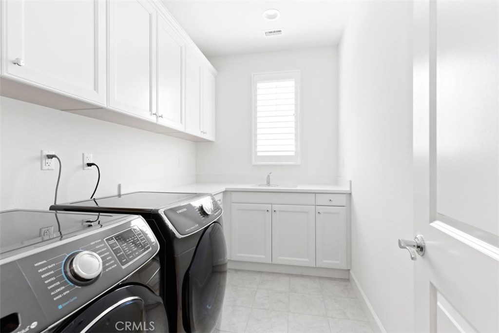 26 Lowland Irvine, CA 92602 - Photo 31 of 44 a room with a sink and cabinets