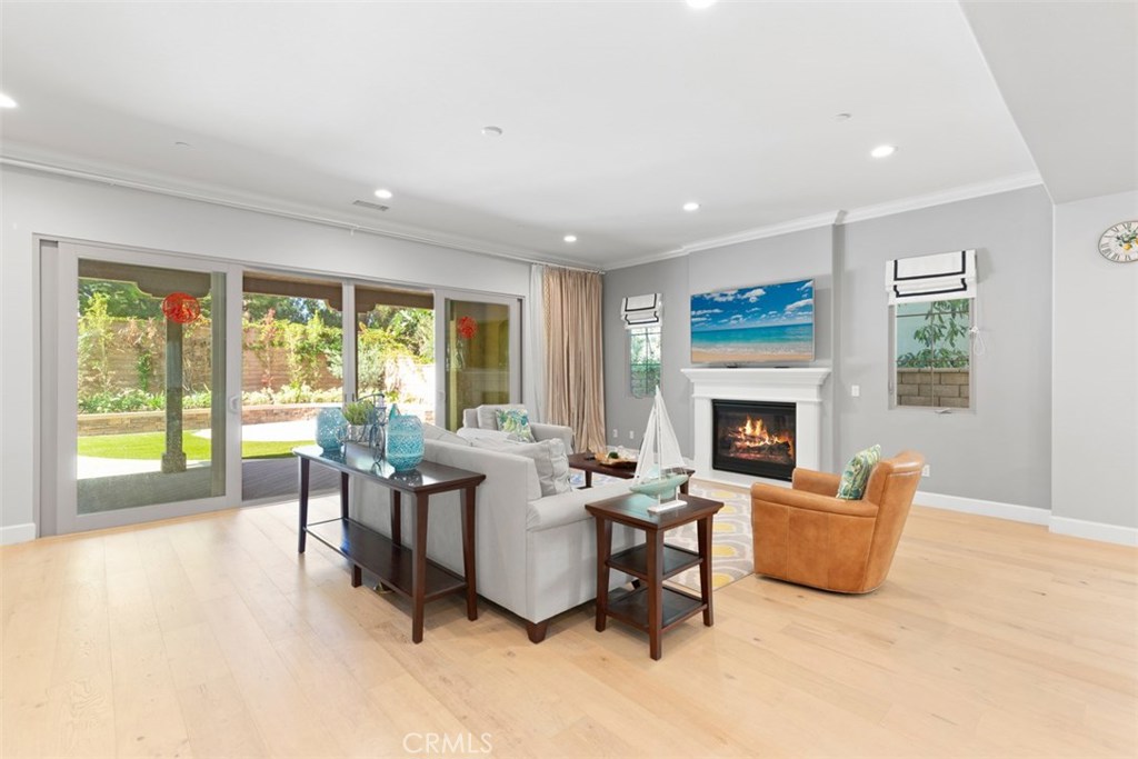 26 Lowland Irvine, CA 92602 - Photo 6 of 44 a living room with furniture and a fireplace
