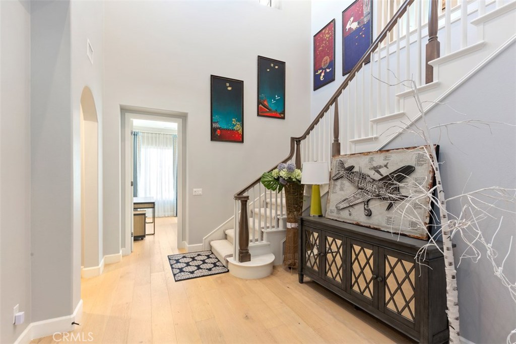 26 Lowland Irvine, CA 92602 - Photo 8 of 44 a view of entryway with stairs and wooden floor