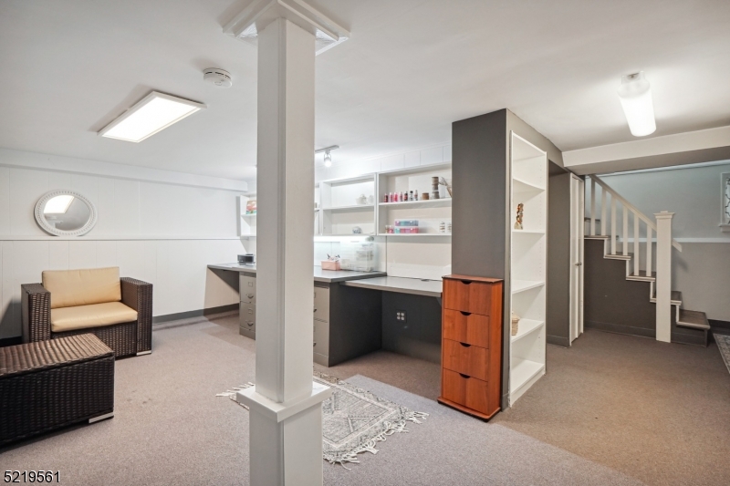 7 Undercliff Road Millburn, NJ 07041 - Photo 12 of 16 a kitchen with stainless steel appliances kitchen island granite countertop a refrigerator and a stove top oven