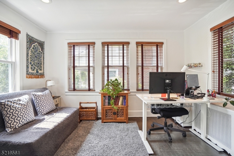 7 Undercliff Road Millburn, NJ 07041 - Photo 6 of 16 a living room with furniture and large windows