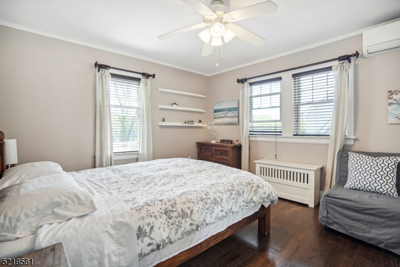 7 Undercliff Road Millburn, NJ 07041 - Photo 8 of 16 a bedroom with a bed and a table