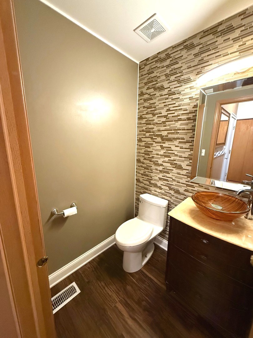 2298 Reflections Drive Aurora, IL 60502 - Photo 13 of 26 a bathroom with a granite countertop toilet and sink