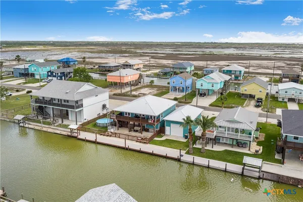 an aerial view of residential houses with outdoor space