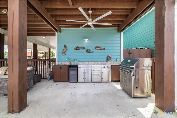 a kitchen with stainless steel appliances granite countertop a stove and a refrigerator