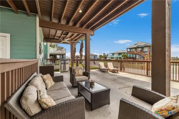a balcony with furniture and a view of the balcony